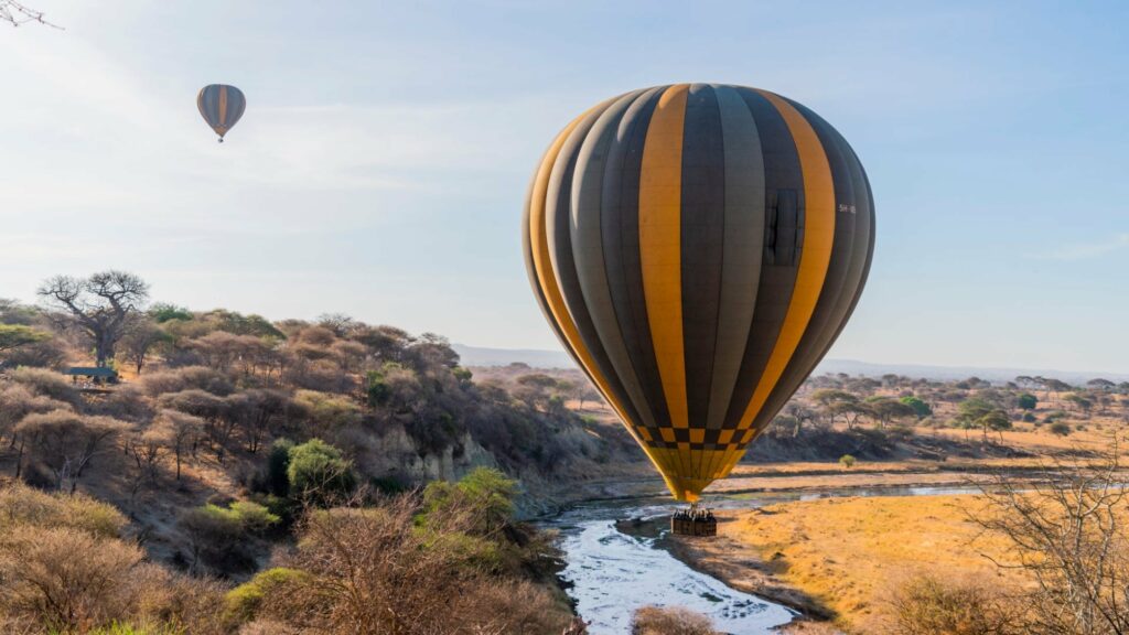 Balloons flying over Tarangire River